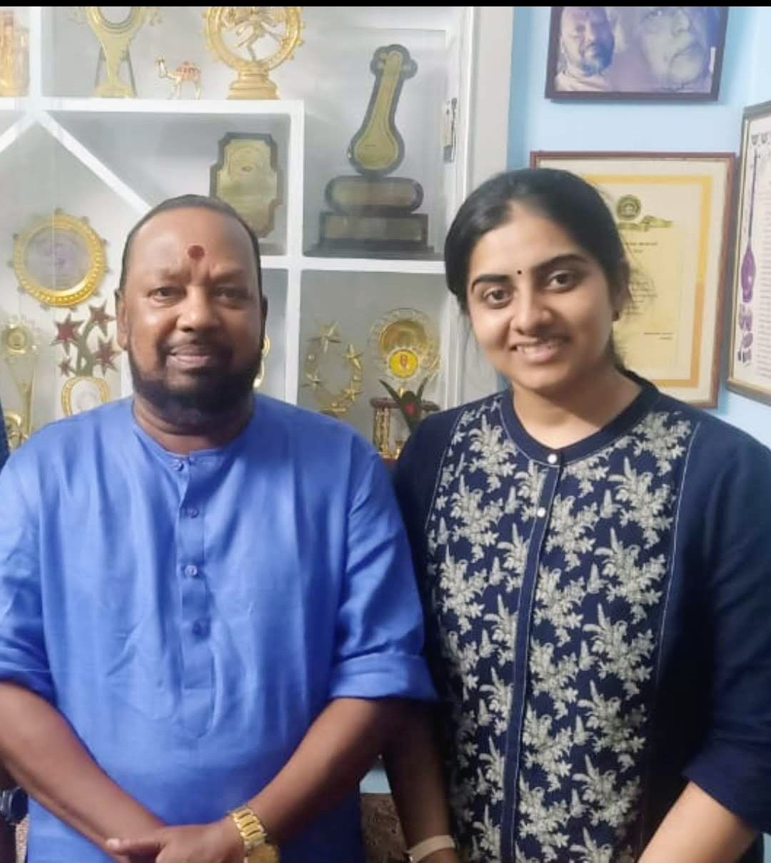 Sarvasri Sukesh with a senior musician among music awards and honours
